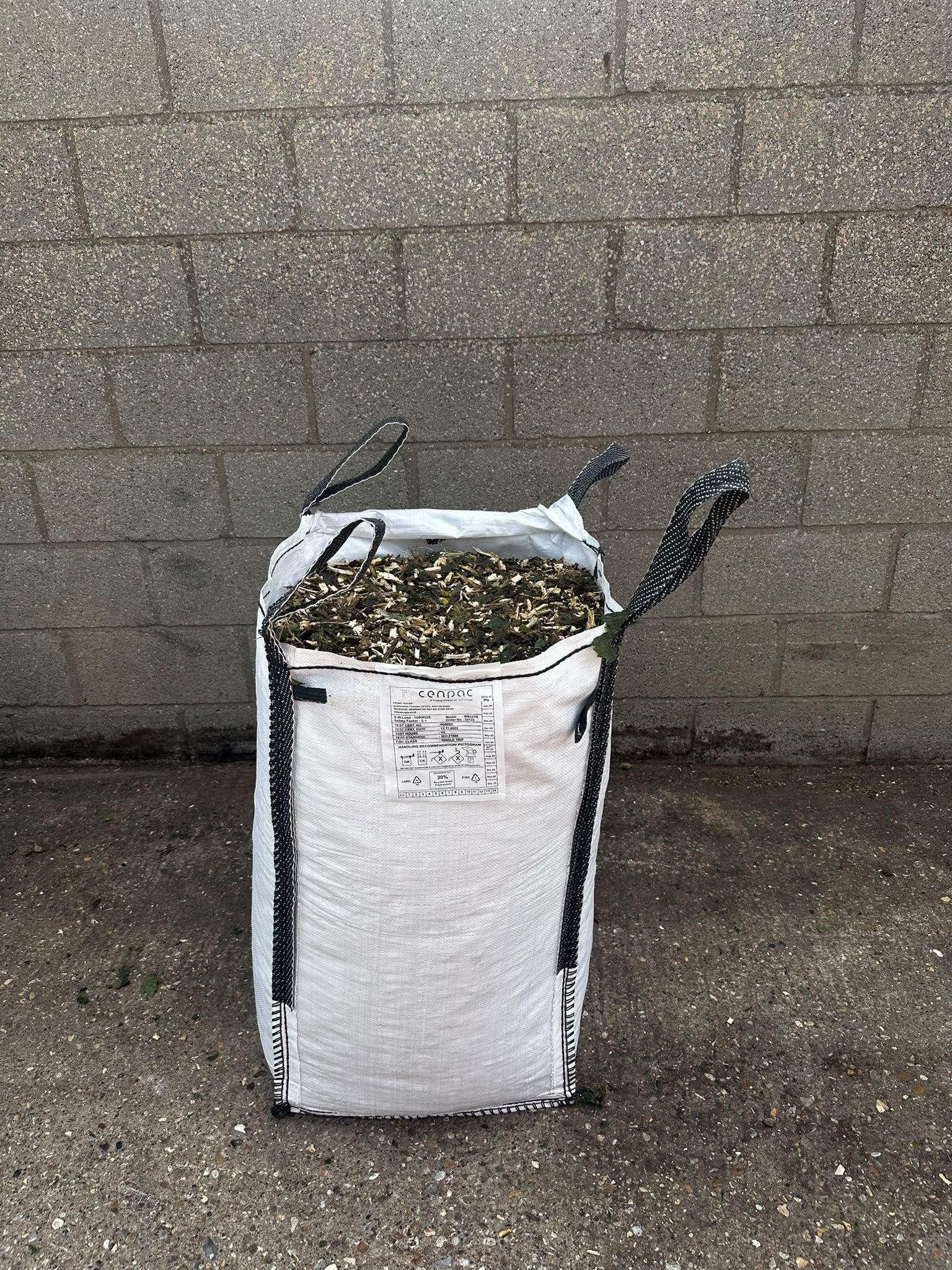 Bag filled with fresh woodland mulch