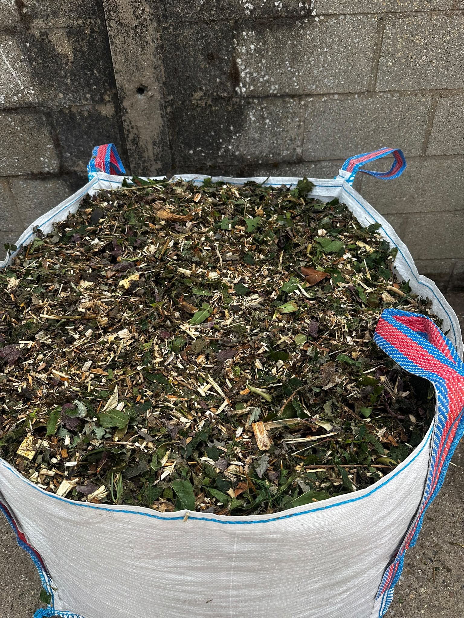 Close-up of fresh woodland mulch in a bulk bag
