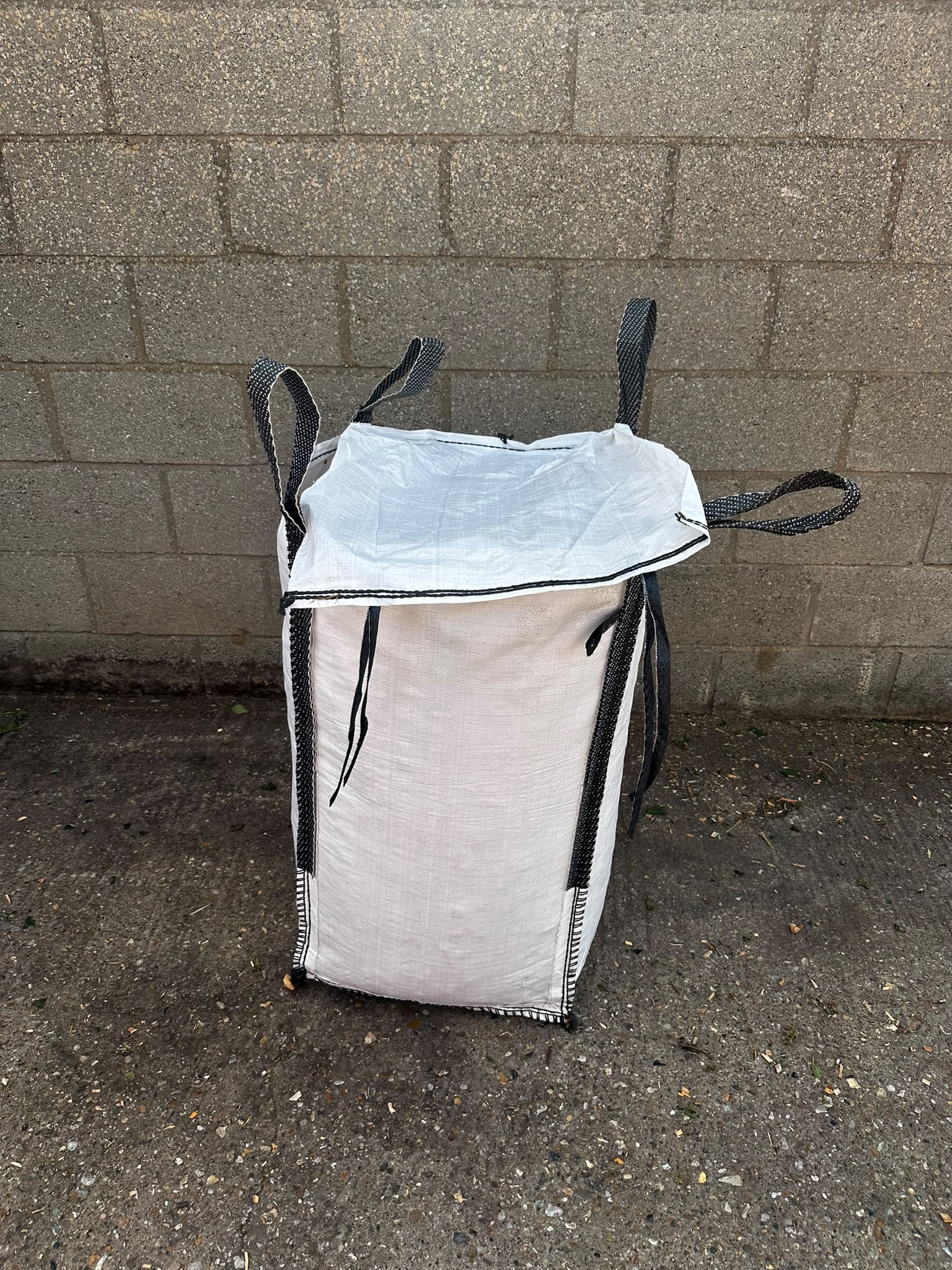 Covered woodchip bag ready for supply